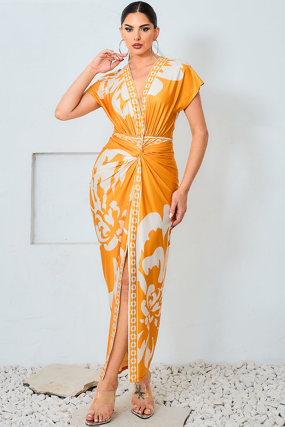 Model wearing floral print v-neck midi dress in mustard
